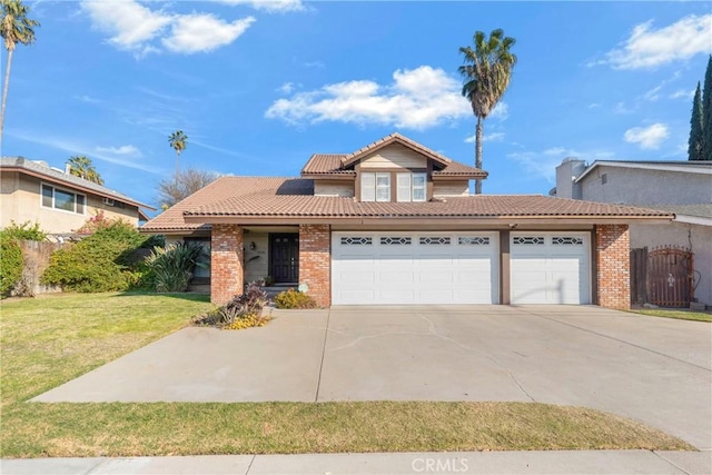 view of front of home with a garage and a front lawn