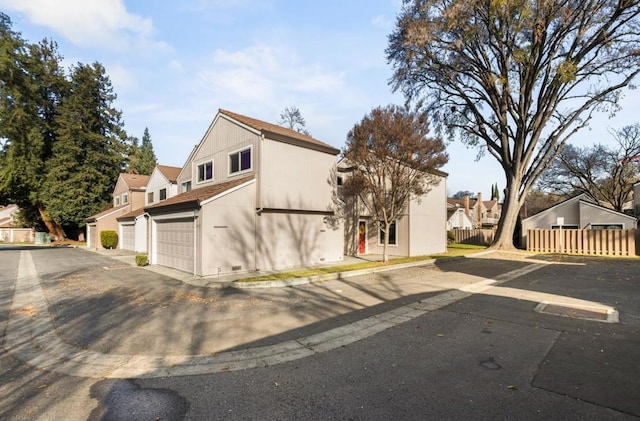 view of side of home featuring a garage