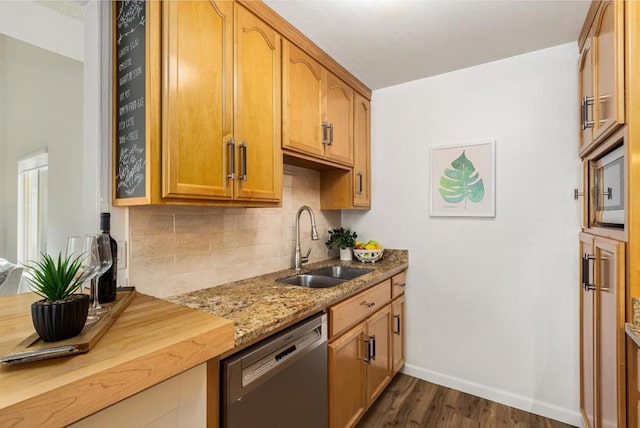 kitchen with sink, dark wood-type flooring, dishwasher, backsplash, and light stone countertops