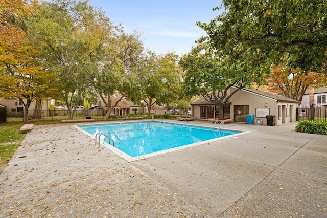 view of swimming pool featuring a patio area