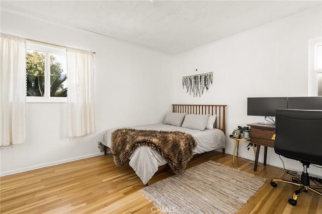 bedroom with hardwood / wood-style floors