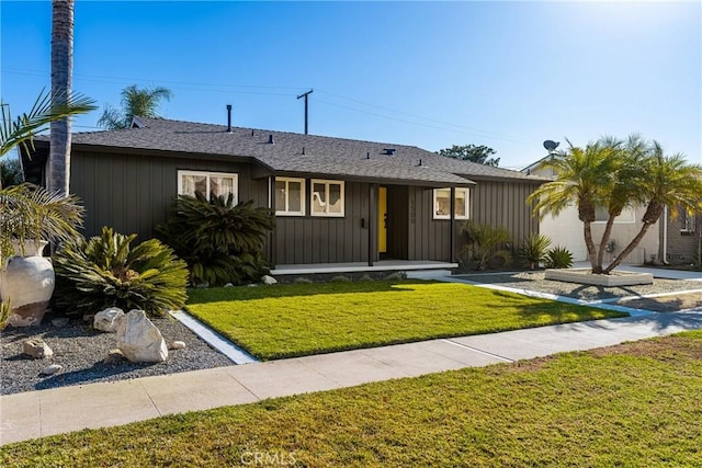 ranch-style house featuring a front lawn