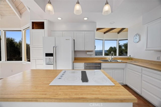 kitchen featuring wooden ceiling, pendant lighting, white cabinets, and high end refrigerator