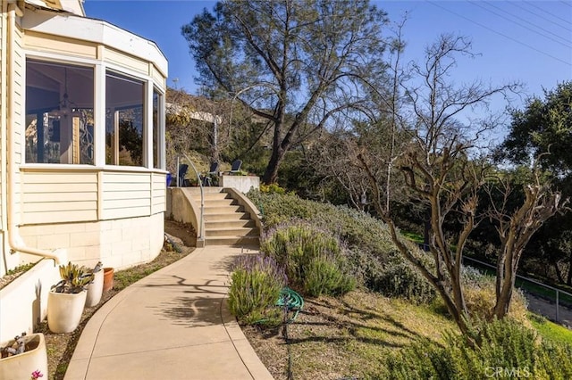 view of yard with a sunroom