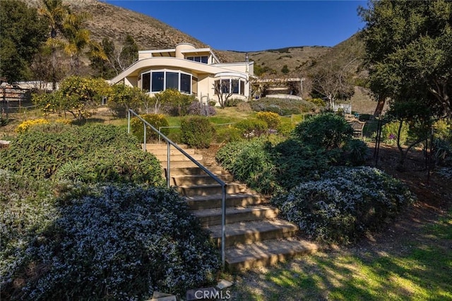 back of property featuring a mountain view