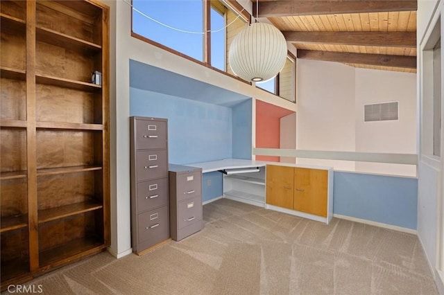 unfurnished office featuring high vaulted ceiling, wooden ceiling, light colored carpet, and beam ceiling