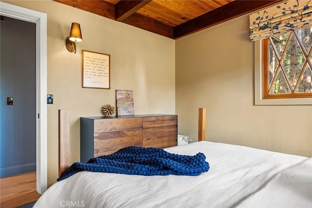 bedroom with wooden ceiling and beamed ceiling