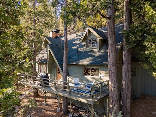 rear view of property with a deck