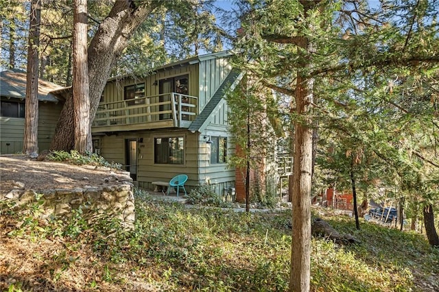 back of house with a balcony