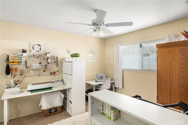 office area with light colored carpet and ceiling fan