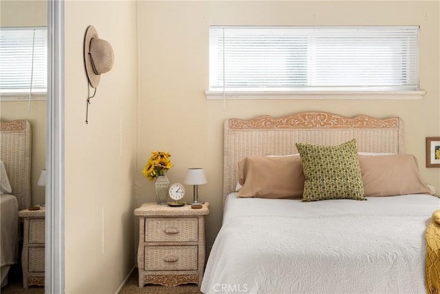 bedroom featuring multiple windows