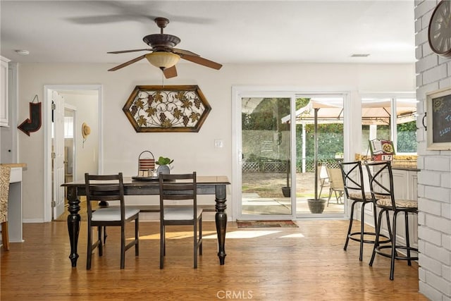 dining room featuring ceiling fan and wood-type flooring