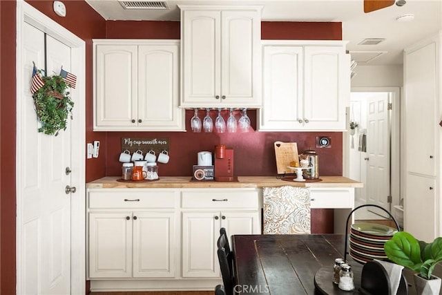 bar with white cabinetry