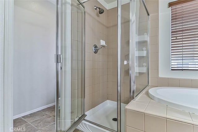 bathroom featuring independent shower and bath and tile patterned flooring