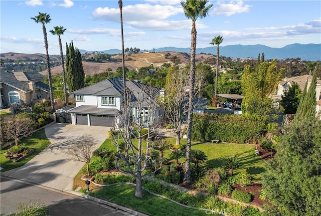 birds eye view of property featuring a mountain view