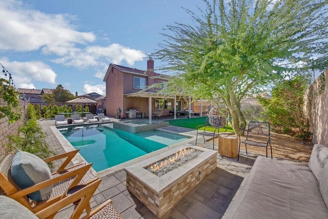 view of swimming pool featuring grilling area, an outdoor fire pit, and a patio