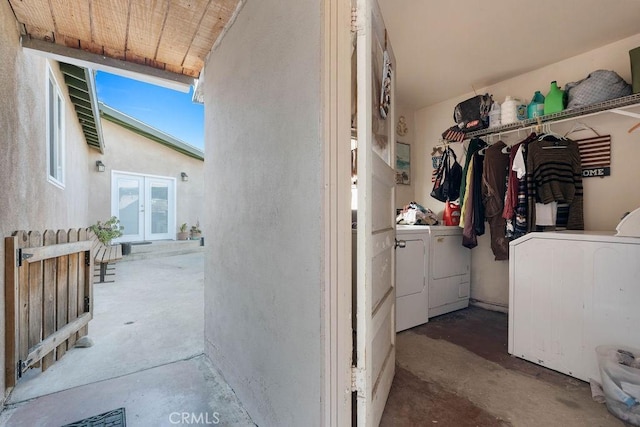 clothes washing area with washing machine and clothes dryer