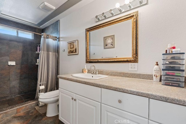 bathroom featuring curtained shower, toilet, and vanity