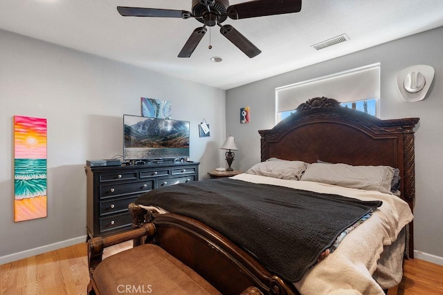 bedroom with ceiling fan and light wood-type flooring