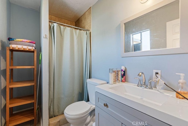 bathroom featuring toilet, vanity, and a shower with shower curtain