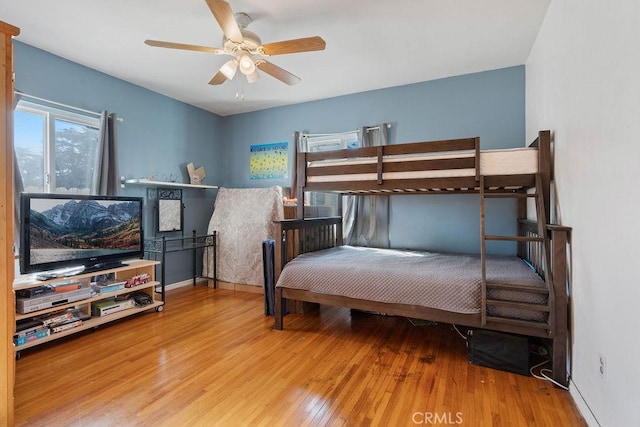 bedroom featuring ceiling fan and hardwood / wood-style floors