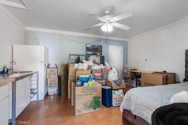 bedroom with ceiling fan, hardwood / wood-style floors, crown molding, and white fridge