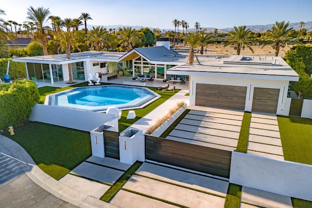 view of swimming pool featuring a lawn