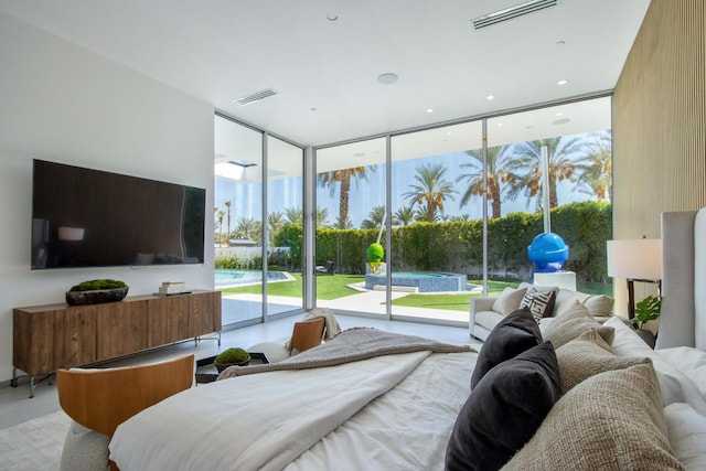 bedroom featuring access to exterior and multiple windows