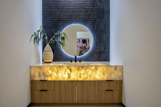 bathroom with decorative backsplash and vanity