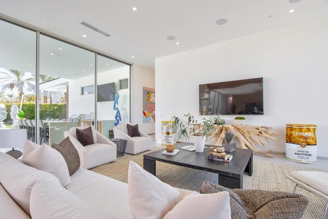 living room with floor to ceiling windows