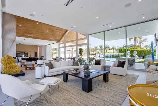 living room featuring wooden ceiling and a wall of windows