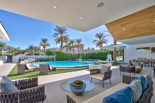 view of pool with an outdoor hangout area and a patio area