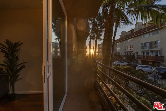 view of balcony at dusk