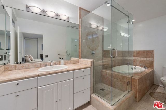 full bathroom with toilet, tile patterned floors, vanity, and plus walk in shower