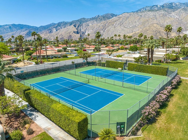 view of tennis court with a mountain view