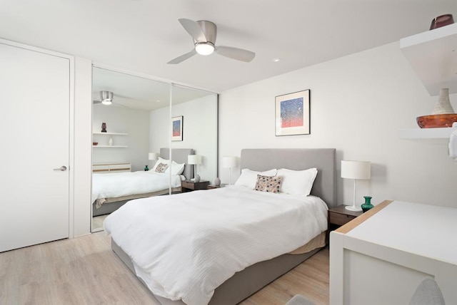 bedroom with ceiling fan and light hardwood / wood-style flooring