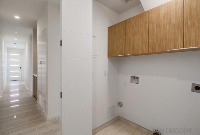 laundry area with cabinets, washer hookup, and hookup for an electric dryer