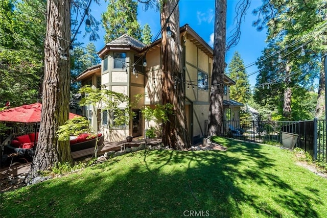 rear view of house with a yard