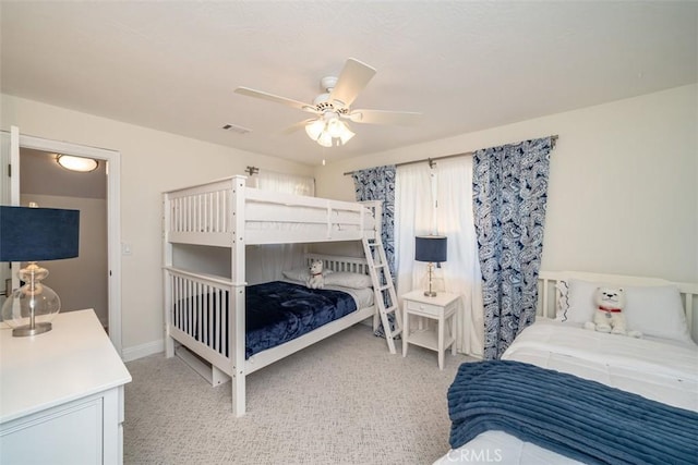 bedroom with light colored carpet and ceiling fan