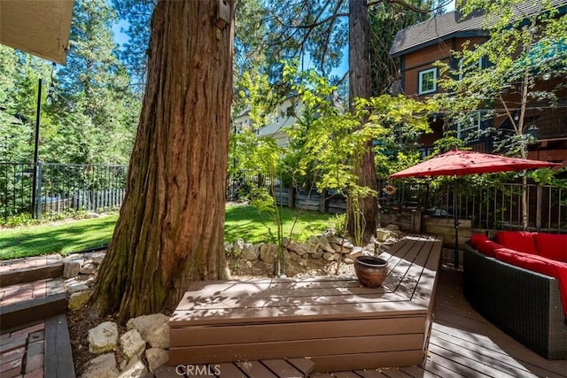 wooden terrace with an outdoor living space