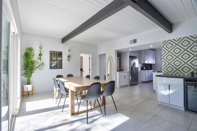 dining space with beamed ceiling, beverage cooler, and wooden ceiling