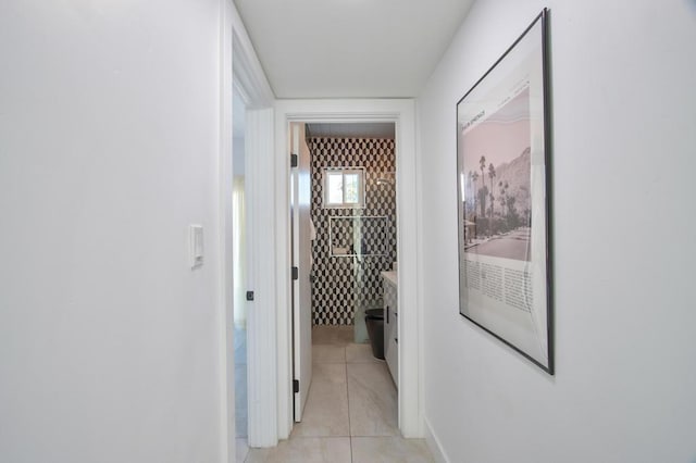 corridor featuring light tile patterned floors