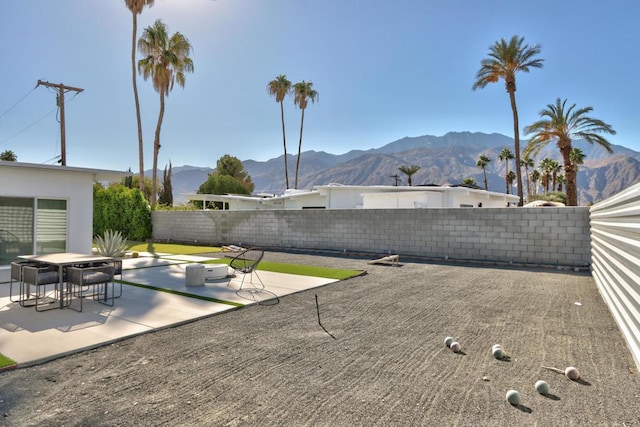 view of patio / terrace featuring a mountain view