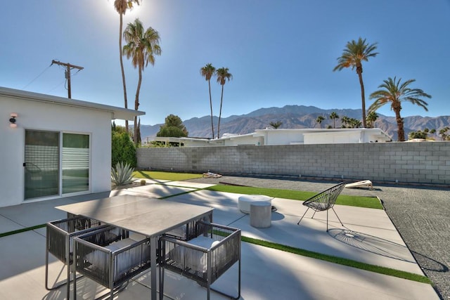 view of patio / terrace with a mountain view