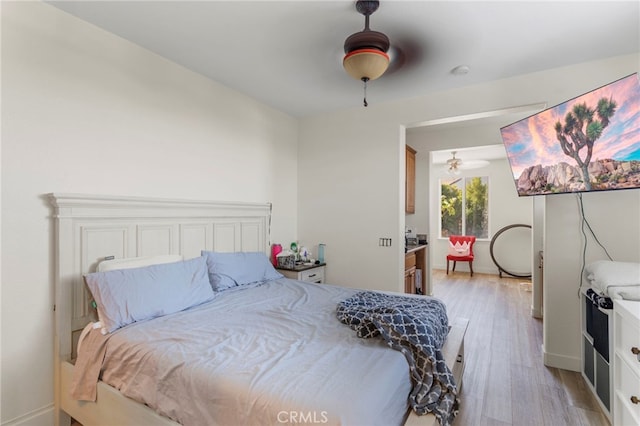 bedroom featuring ceiling fan and light wood-type flooring