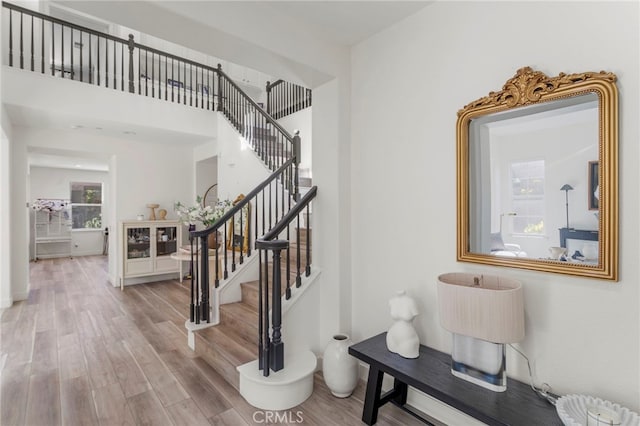 foyer entrance with light wood-type flooring and plenty of natural light