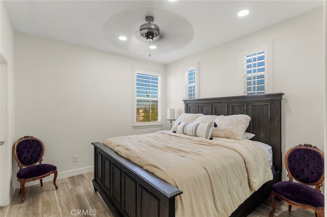 bedroom featuring ceiling fan and light hardwood / wood-style flooring