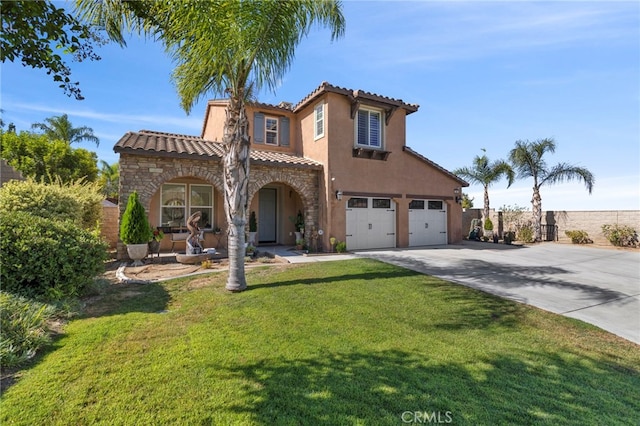 mediterranean / spanish-style house featuring a front yard and a garage