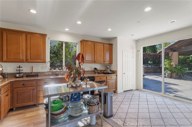 kitchen featuring light hardwood / wood-style floors and stone countertops