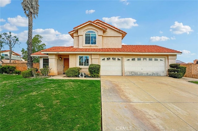 mediterranean / spanish-style home with a front lawn and a garage